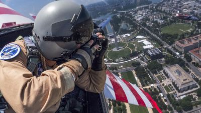 Think you look cool with a camera in hand? Nobody’s as cool as this NASA photographer riding in an F-18 jet!