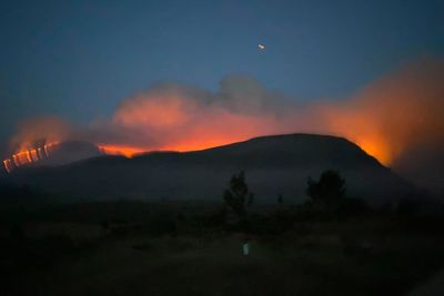 Firefighters work through night tackling wildfire which has led to evacuations