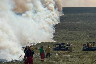 Firefighters spend second day tackling wildfire which has led to evacuations
