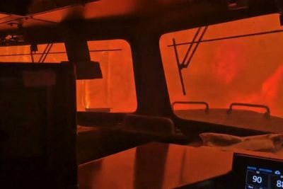 Intense flames surround train crew as wildfire rages in Canada