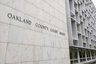 Michigan woman pleads no contest to abuse after 3 kids are found living alone for years