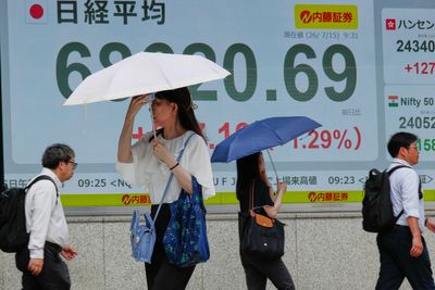 Asian shares sink, with Tokyo down nearly 5% as slumping AI stocks drag world markets lower