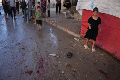 An Israeli strike on a funeral in Gaza kills 7 people and wounds 22, a local hospital says