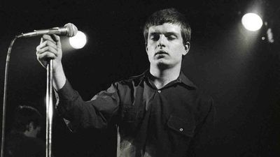“We would just have done it balls out, legs akimbo like Status Quo. and probably messed it up”: The classic song that gave an iconic post-punk band their biggest hit – and became an epitaph for their tragic singer
