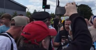Police called and busy road closed amid protest in Glasgow after woman robbed