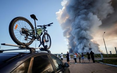 Ukrainian strikes on Russian warehouses kill 8, shroud skies in smoke