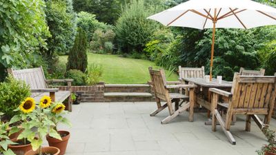 This 2-in-1 Antique-Style Hose Pot Turns an Unsightly Garden Hose Into a Stylish Feature