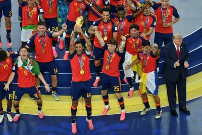 Trump lingers on stage to lap up World Cup spotlight