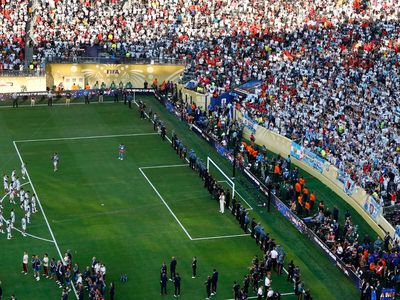 They sing, they stomp, they dance. World Cup fans from Argentina, Spain spent cash at the final