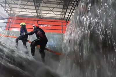 People brave simulated typhoons in China to prepare for real thing