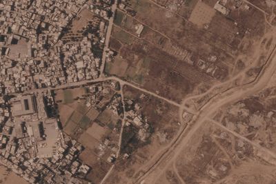 Israel is building a miles-long earthen barrier inside Gaza, entrenching its division
