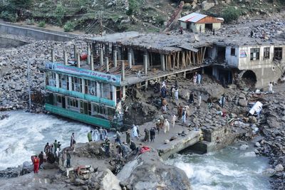 Rescue crews in Afghanistan search for missing, dead in rubble left by flash flooding
