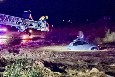 Daring rescue as firefighters pluck stranded driver from raging Arizona monsoon floods
