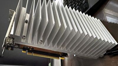 PC modder bolts 5.5-pound aluminum heatsink to RTX 4060 — convection-only cooling seems to work fine in a testbench-style installation