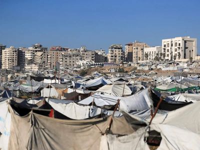As truce stalls, Israel is redrawing Gaza with a giant earthen barrier