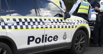 Car allegedly crashes into police vehicle after running red light
