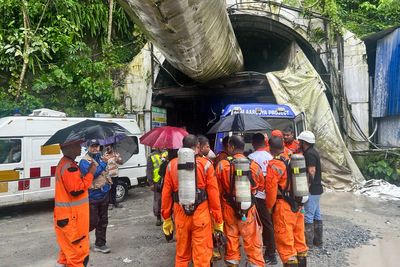 Toxic gas slows efforts to rescue 13 workers trapped in India hydropower tunnel
