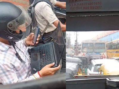 Viral video shows two-wheeler rider working on laptop in Mumbai traffic jam, Social media users point out people are chained to their work