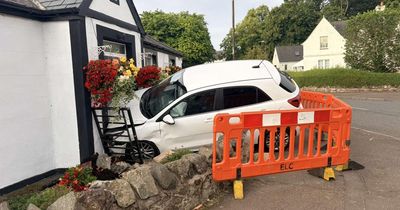 Car smashes into house while couple were sat watching TV