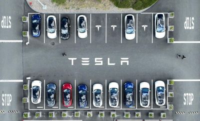Tesla’s profits slide despite growing revenue as it pivots to robotics and AI