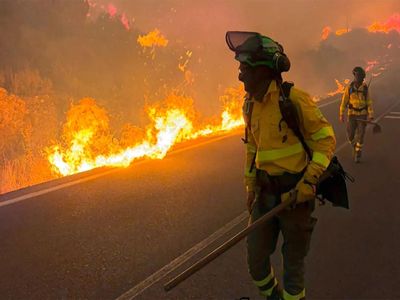 Firefighters battle one of Spain's biggest-ever wildfires during heat wave across the Mediterranean