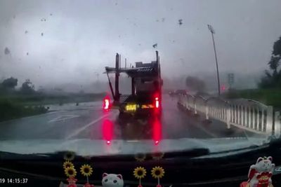 Tornado picks up car and flings it across road in dramatic video