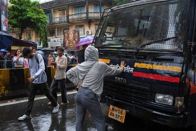One image defines India’s ‘cockroach’ protests: a 27-year-old woman before a police van of detainees