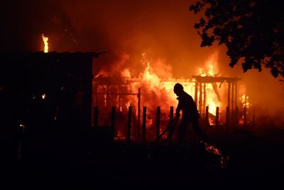 Tens of thousands flee wildfires as heatwave grips southern Europe