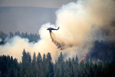 Oregon firefighters brace for windy and hot weather as they battle dozens of blazes