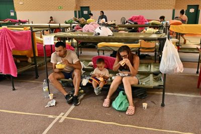 With minutes to flee, Spain fire evacuees grab what they can