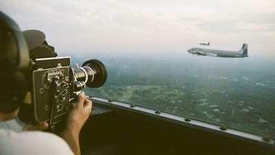 This vintage Red Bull airplane hasn’t flown over the US since the 1950s – so an artist captured the flight with an equally vintage camera from a WWII bomber