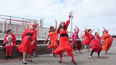 Hundreds dressed in red recreate Kate Bush’s Wuthering Heights dance