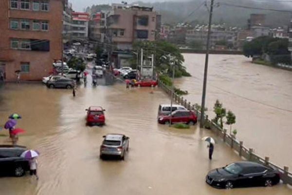 Stranded tourists evacuated from China's famed Jiuzhaigou World Heritage site after mudslides, heavy rain