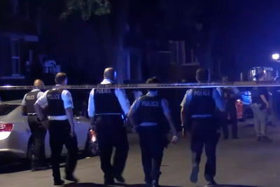 Manhunt for gunman after six injured in Chicago shooting that left two fighting for life
