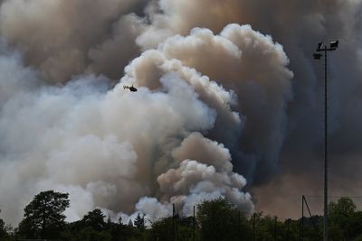 Snow in Athens while France is on fire: The images that lay bare contrast in extreme weather across Europe