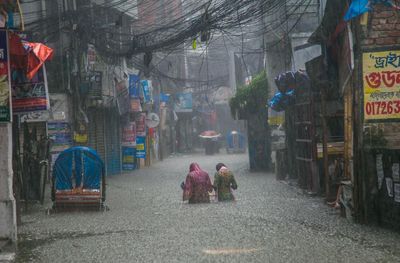 ‘We have lost everything’: extreme rainfall across Asia brings flash floods and typhoons