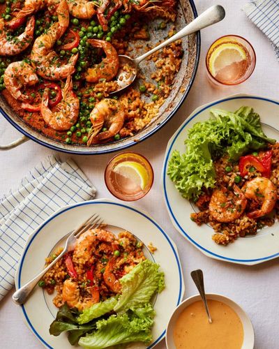 Spanish summer recipes: Thomasina Miers’ grilled prawns, red rice and boozy baked peaches