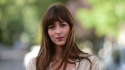Dakota Johnson's West Hollywood Living Room Balances Warm Mid-Century Style With Architectural Glass for a Seamless Indoor-Outdoor Flow