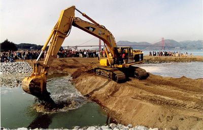 An ancient 130-acre California salt marsh was filled, drained and turned into an airfield; a century later, crews removed 230,000 cubic yards of soil to let the tides return