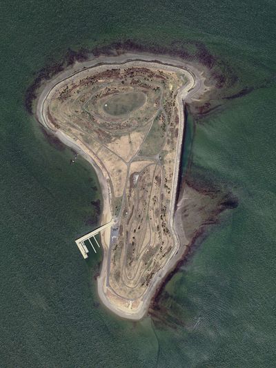 In 1959, Boston closed a harbour island dump where underground fires smouldered for years; Big Dig soil later sealed the waste before Spectacle Island reopened as a park in 2006