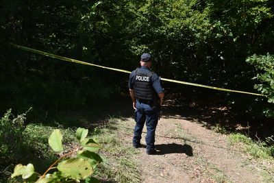 Forensic teams search a suspected mass grave from the Kosovo war