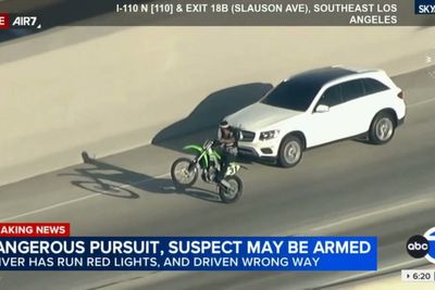 Driver fleeing cops in LA accidentally ends up with a dirt bike escort after almost running down scooter rider