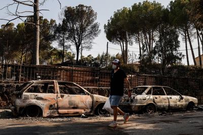 ‘The breath just went out of us’: people return to their homes after wildfires near Madrid