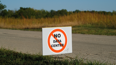 Teacher arrested for clapping in support of opposition at an AI data center meeting — gigawatt-scale project gets approved anyway despite community resistance