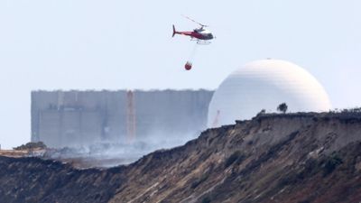 Wildfire in eastern England rages as France and Spain win some respite