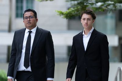 French student pleads guilty and is fined for a straw-licking stunt in Singapore
