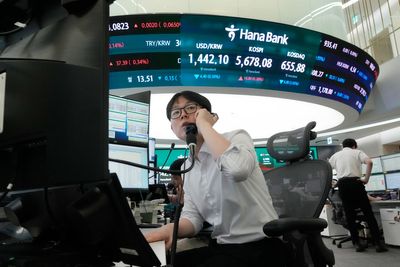 Oil prices slip and Asian shares are mostly lower as investors sell chipmaker stocks
