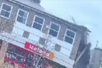 Masonry rains down on busy high street as roof above Iceland supermarket collapses
