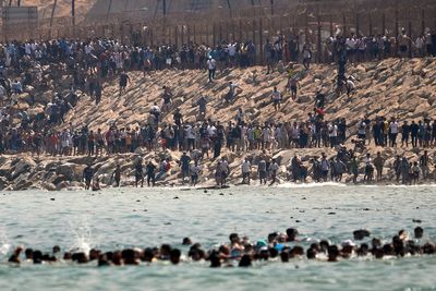 Italy wants Spain suspended from Schengen zone after thousands breach Morocco’s border to cross over to Ceuta