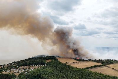 Holiday park evacuated as firefighters battle huge wildfire near nuclear power plant